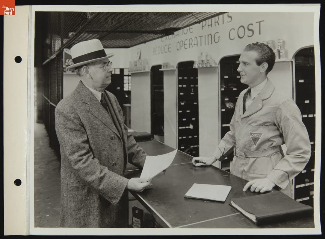 Customer Receiving Bill at Ford Dealership Parts Counter, August 1936