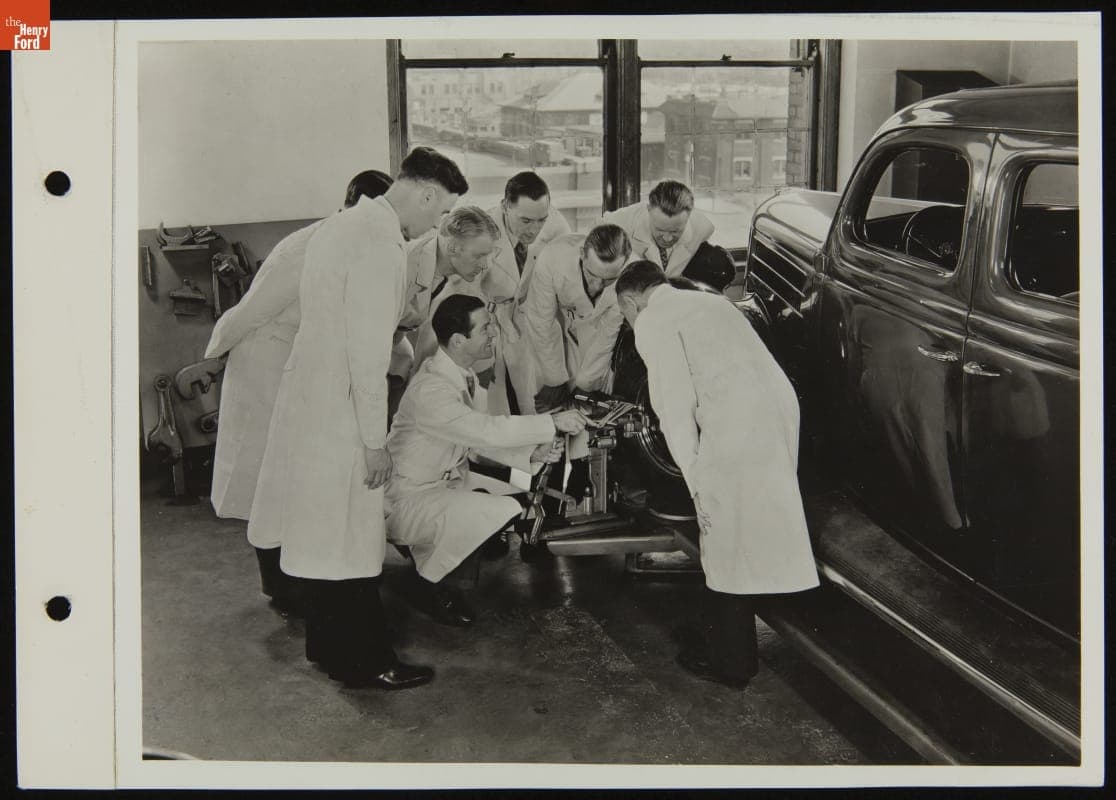 Service Attendants Gathered Around Tire Alignment Equipment, June 1937