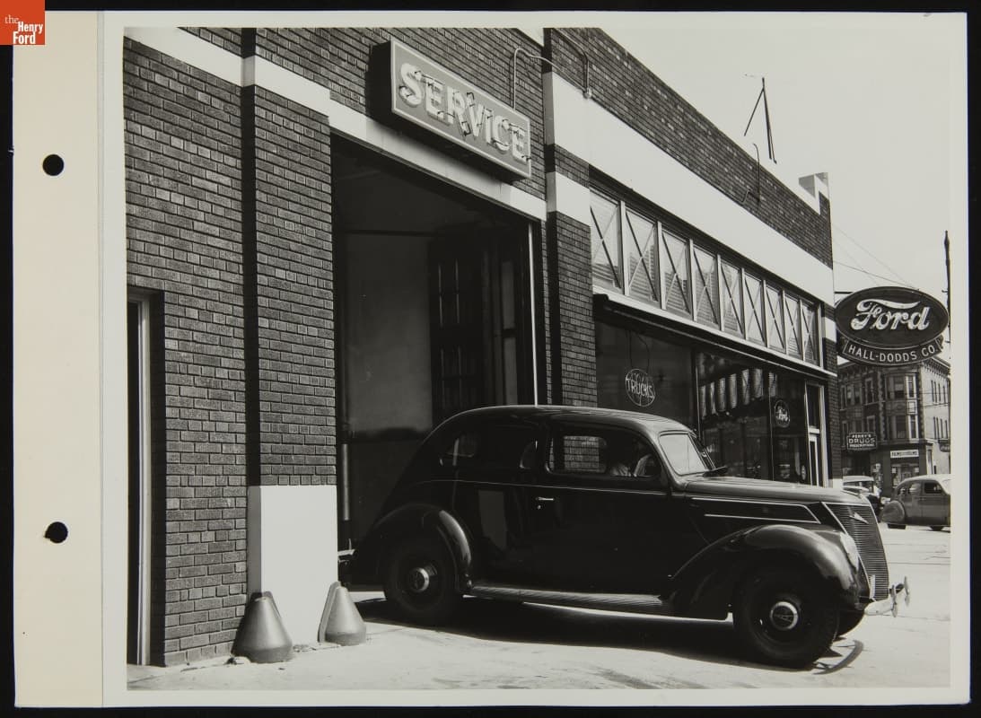 Ford V-8 Car Leaving Hall-Dodds Co. Service Station, August 1937