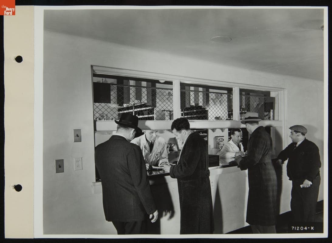 Customers at Service Counter, Robert W. Ford Dealership, Michigan Avenue, Dearborn, Michigan, December 1938