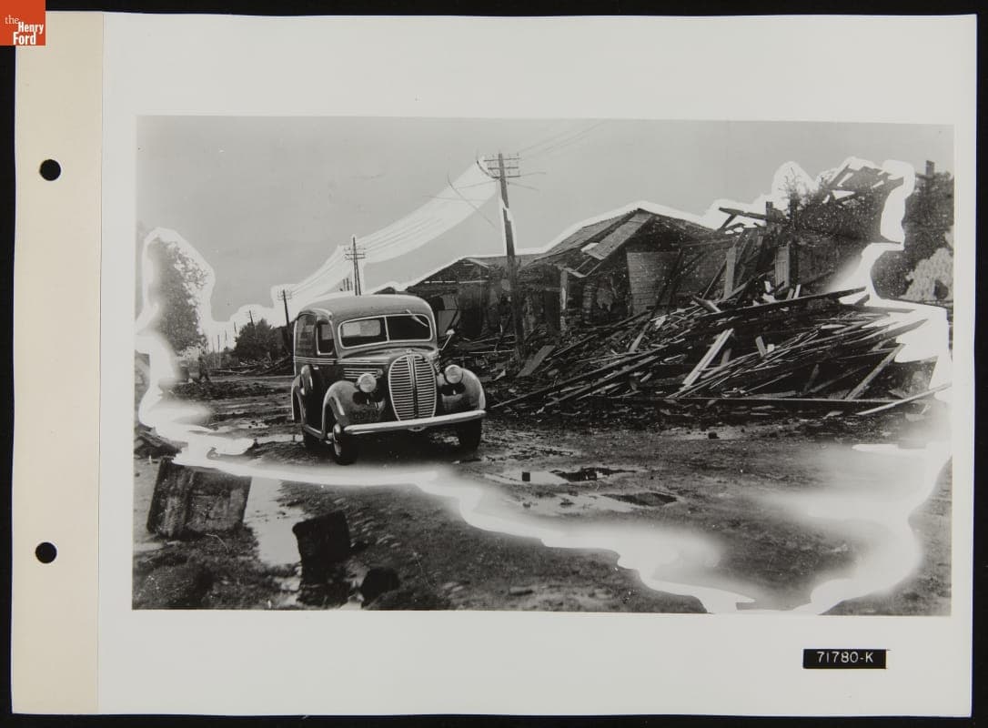 Parts Delivery Car with Broken Down Buildings, Illustration in April 1939 Ford Merchandising Bulletin