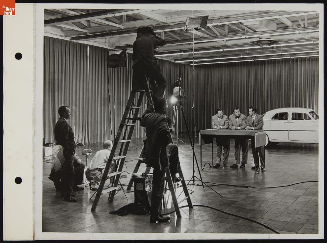 Henry Ford II, Benson Ford, and William Clay Ford with Photographers in Ford Engineering Laboratory Styling Studio, June 1950