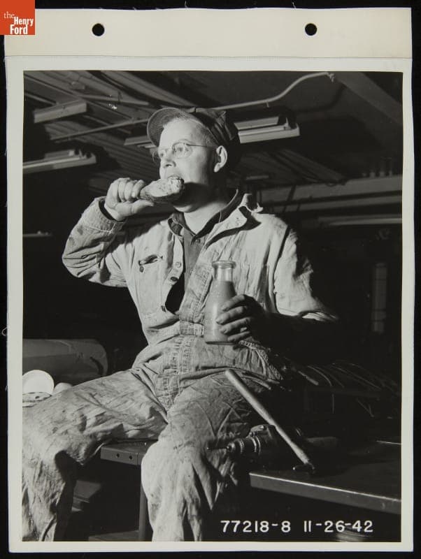 Ford Employee Harry Finn Eating Thanksgiving Dinner on the Job at the Highland Park Plant, November 1942