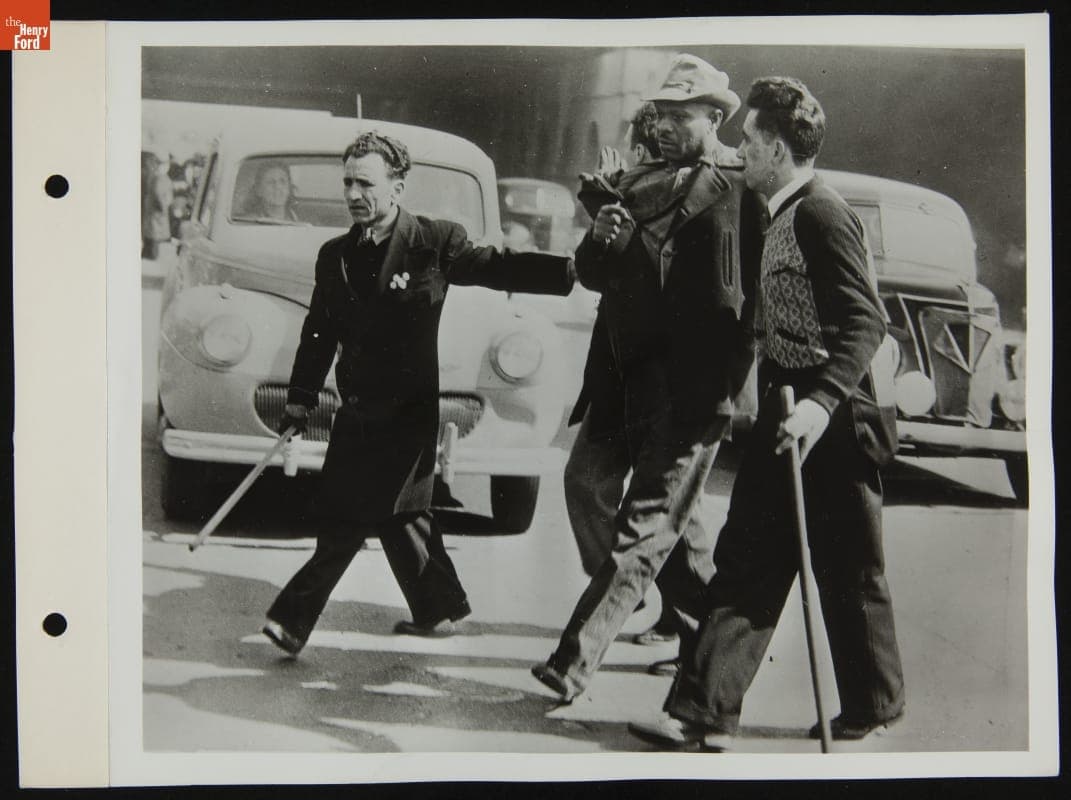 Strikers Escorting Man from Ford Rouge Plant, April 1941