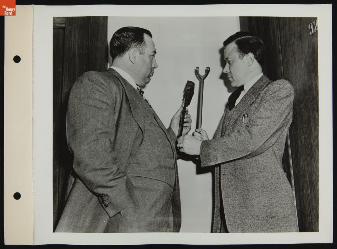 R.J. Thomas and Walter Reuther Holding Weapons from Workers, April 1941