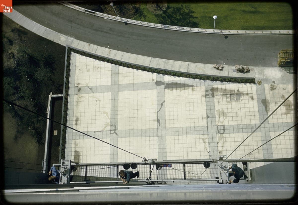 Overhead View of Men Working on South Facade Windows, Henry Ford II World Center, circa 1955