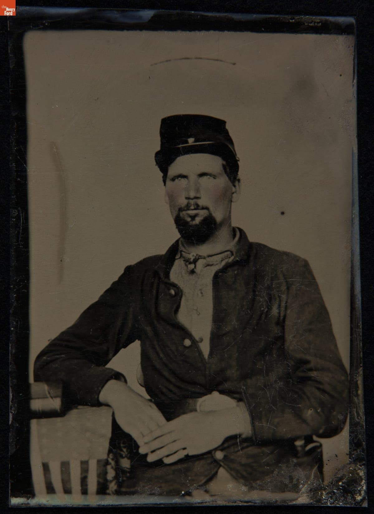 Seated Soldier with an American Flag, 1860-1869