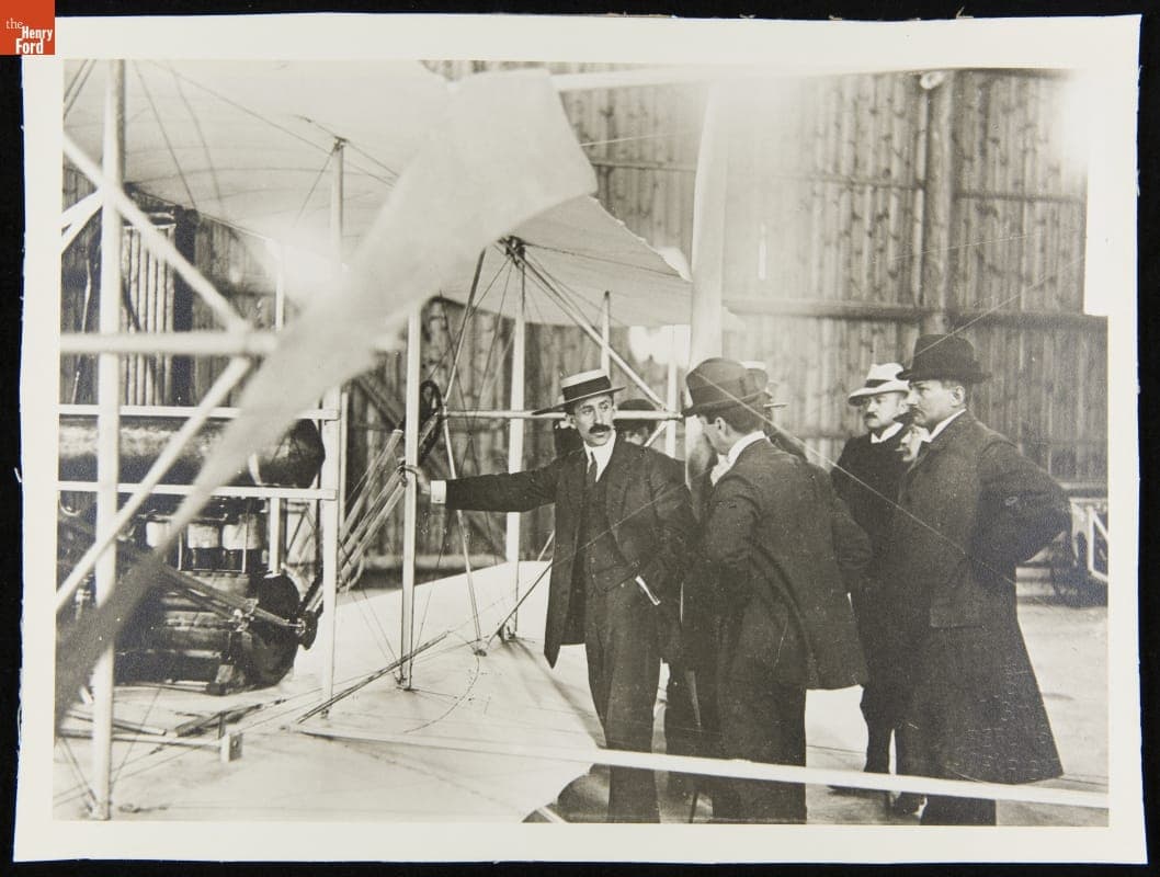 Orville Wright Explains the Airplane to a Group in the Hangar at Templehof, Germany, 1909