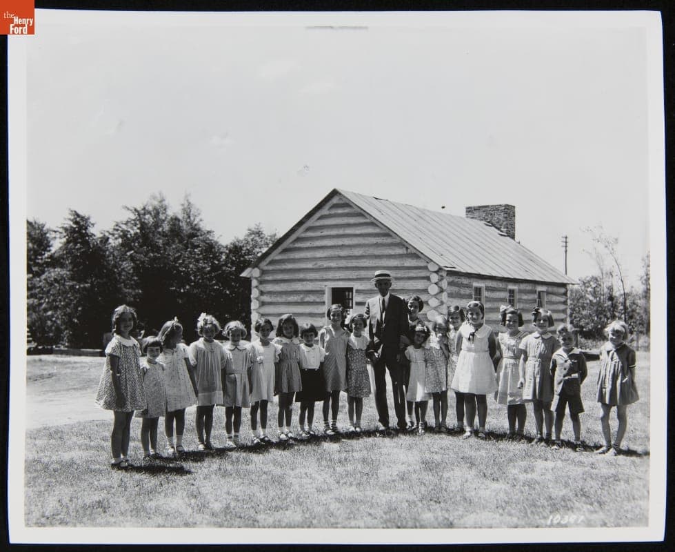 Henry Ford with Edison Institute Schoolchildren outside McGuffey School, Greenfield Village, June 1934