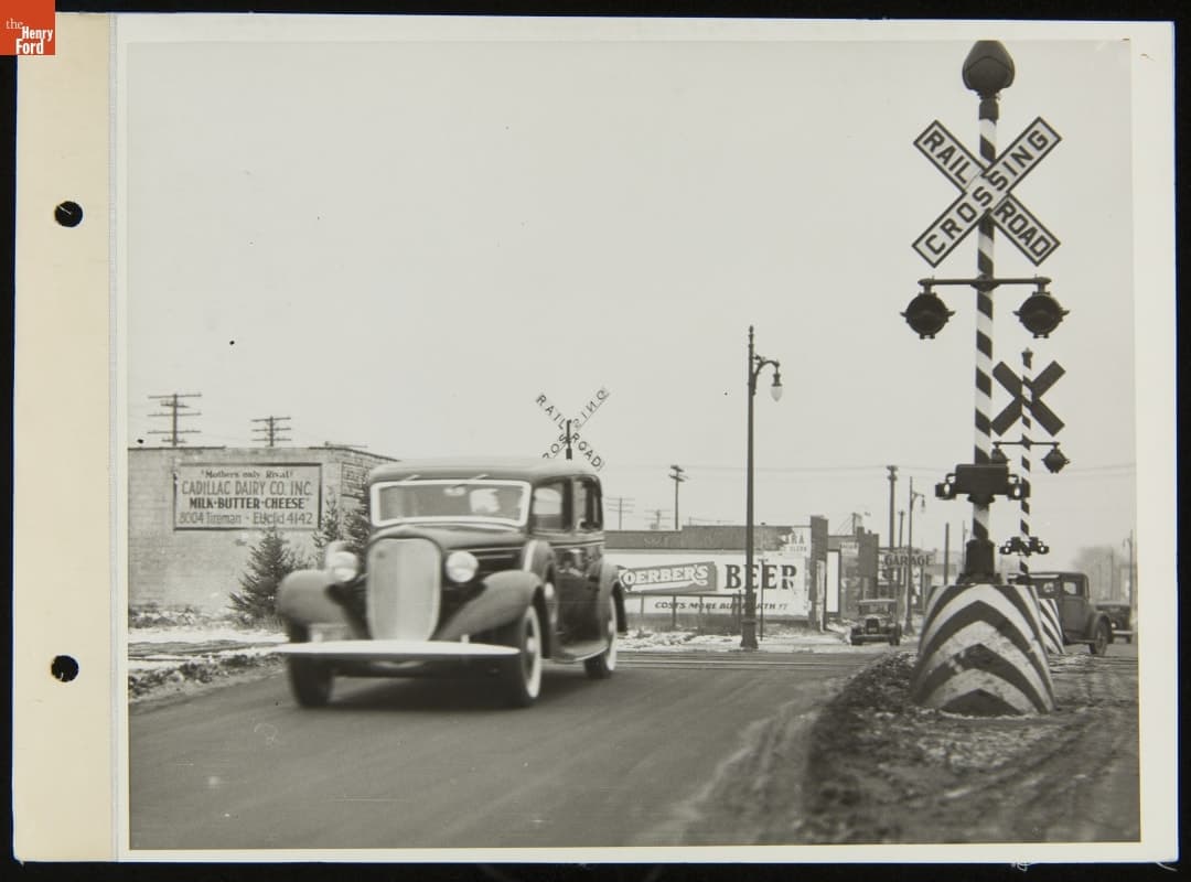 Lincoln Automobile Driving Over Railroad Crossing, December 1934