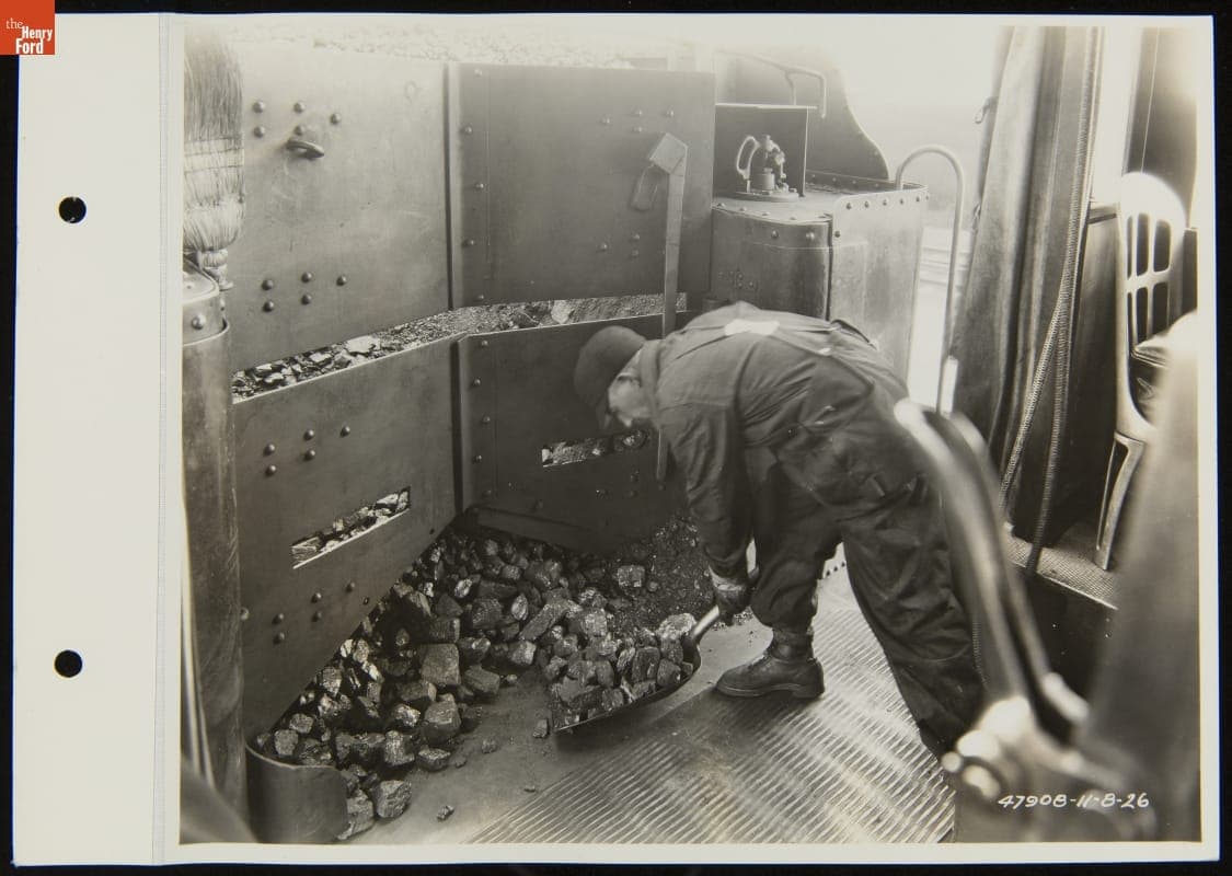 Railroad Fireman Shoveling Coal inside Steam Locomotive, Detroit, Toledo & Ironton Railroad, November 1926