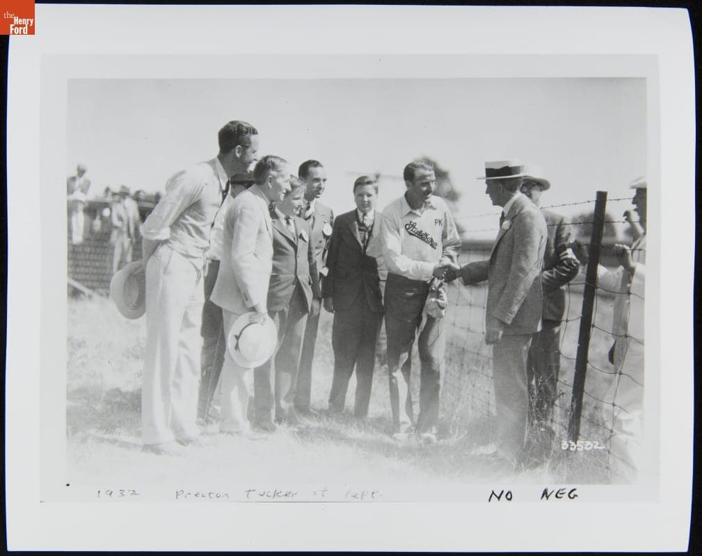 Preston Tucker, Harvey Firestone, Benson Ford, Edsel Ford and Henry Ford II Watch Peter Kreis Shake Hands with Henry Ford, 1932