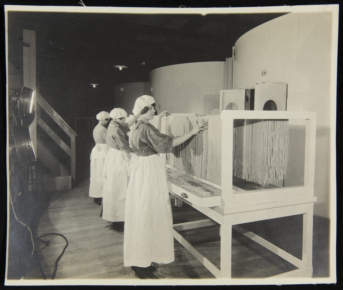 Heinz Employees Spreading Spaghetti along a Rack, circa 1910