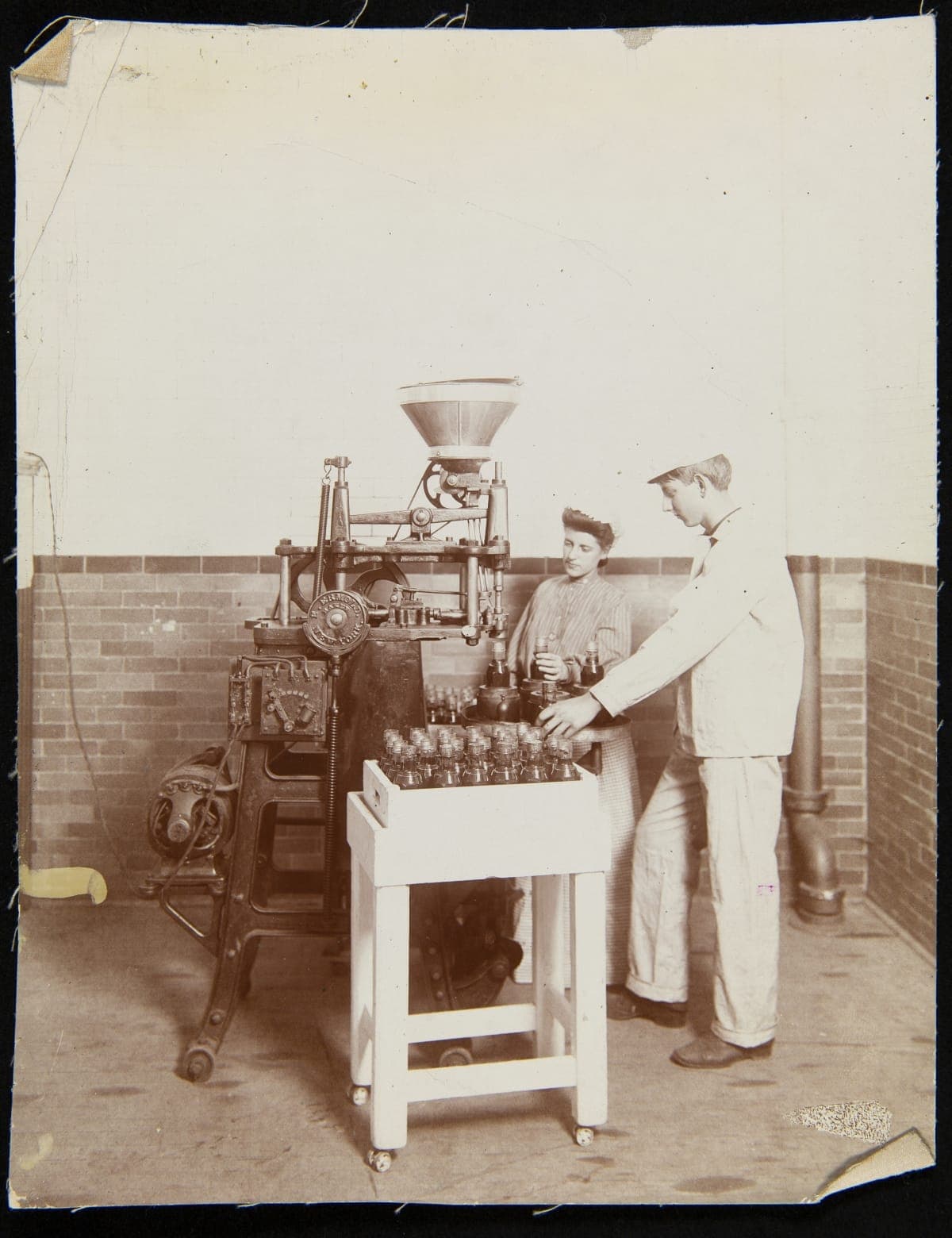 Employees Operating a Capping Machine, H. J. Heinz Company, Pittsburgh, Pennsylvania, circa 1905