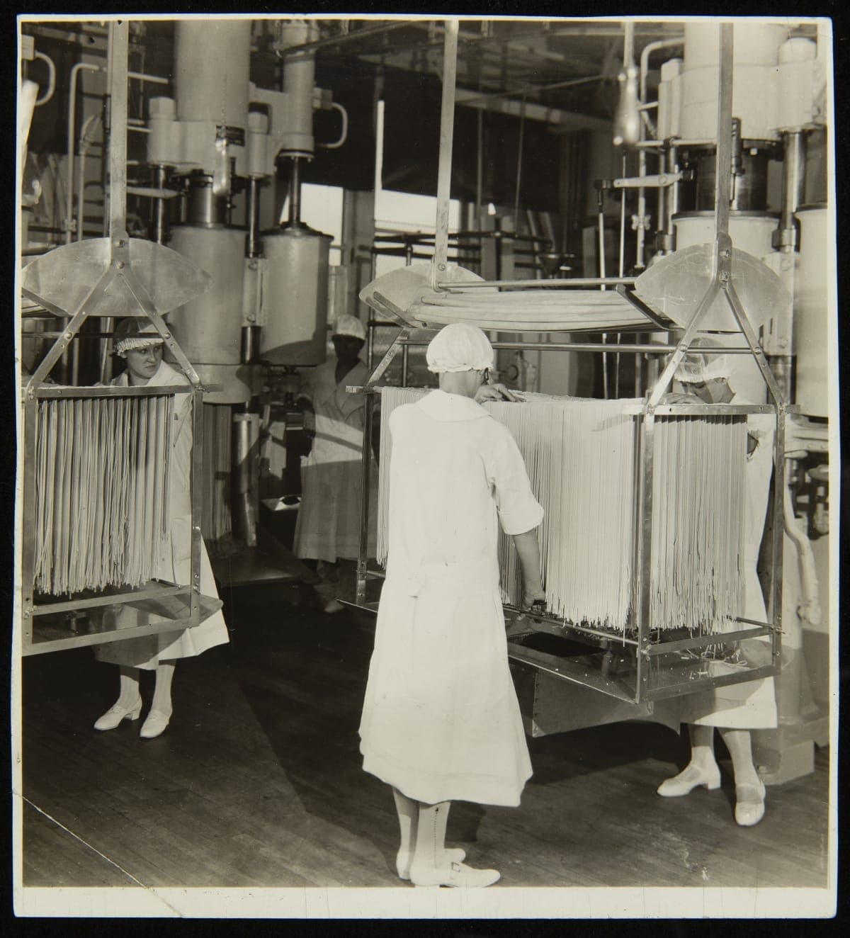 Employees Hanging Spaghetti on Drying Racks at Main Plant, Pittsburgh, Pennsylvania, H. J. Heinz Company, circa 1910