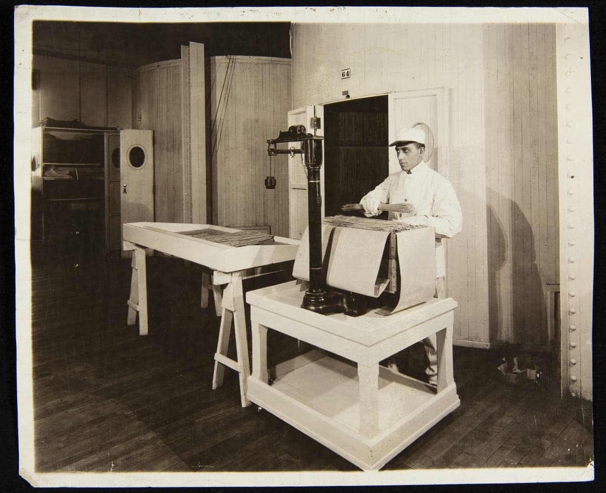 Employee Weighing Dried Spaghetti in Main Plant, H. J. Heinz Company, Pittsburgh, Pennsylvania, 1917