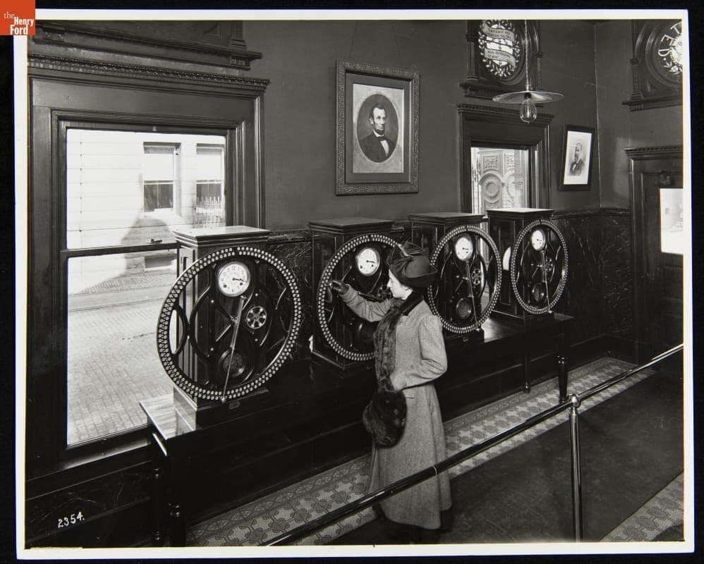 Woman Using Time Clock at the Main Plant, H. J. Heinz Company, Pittsburgh, Pennsylvania, 1911