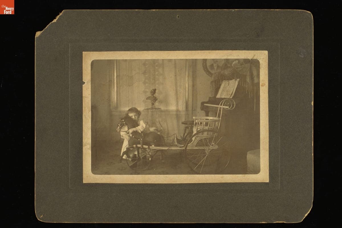 Child inside Room, with Toy Horse and Baby Carriage, circa 1900