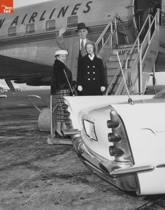 Virgil M. Exner with Wife and Daughter, Boarding Airplane, 1956