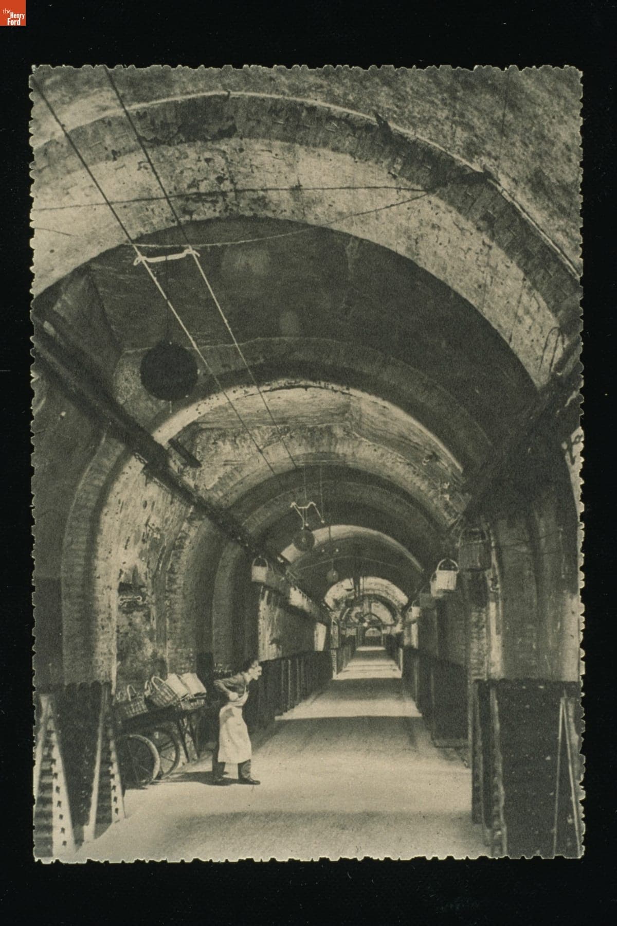 Worker in a Gallery with Wine Bottles at Champagne Pommery & Greno near Rheims, France, circa 1925