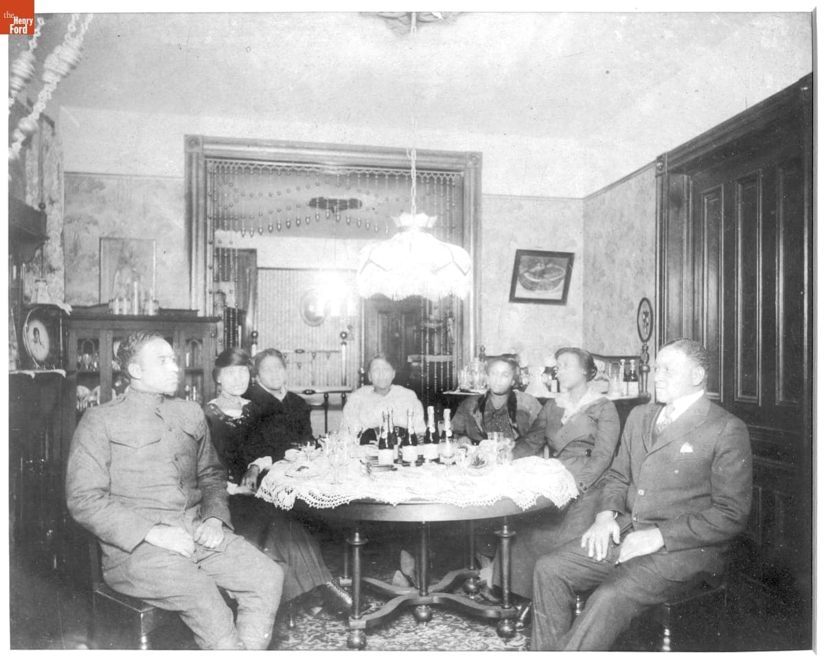 Family Seated around a Table with Champagne Bottles, 1918-1919
