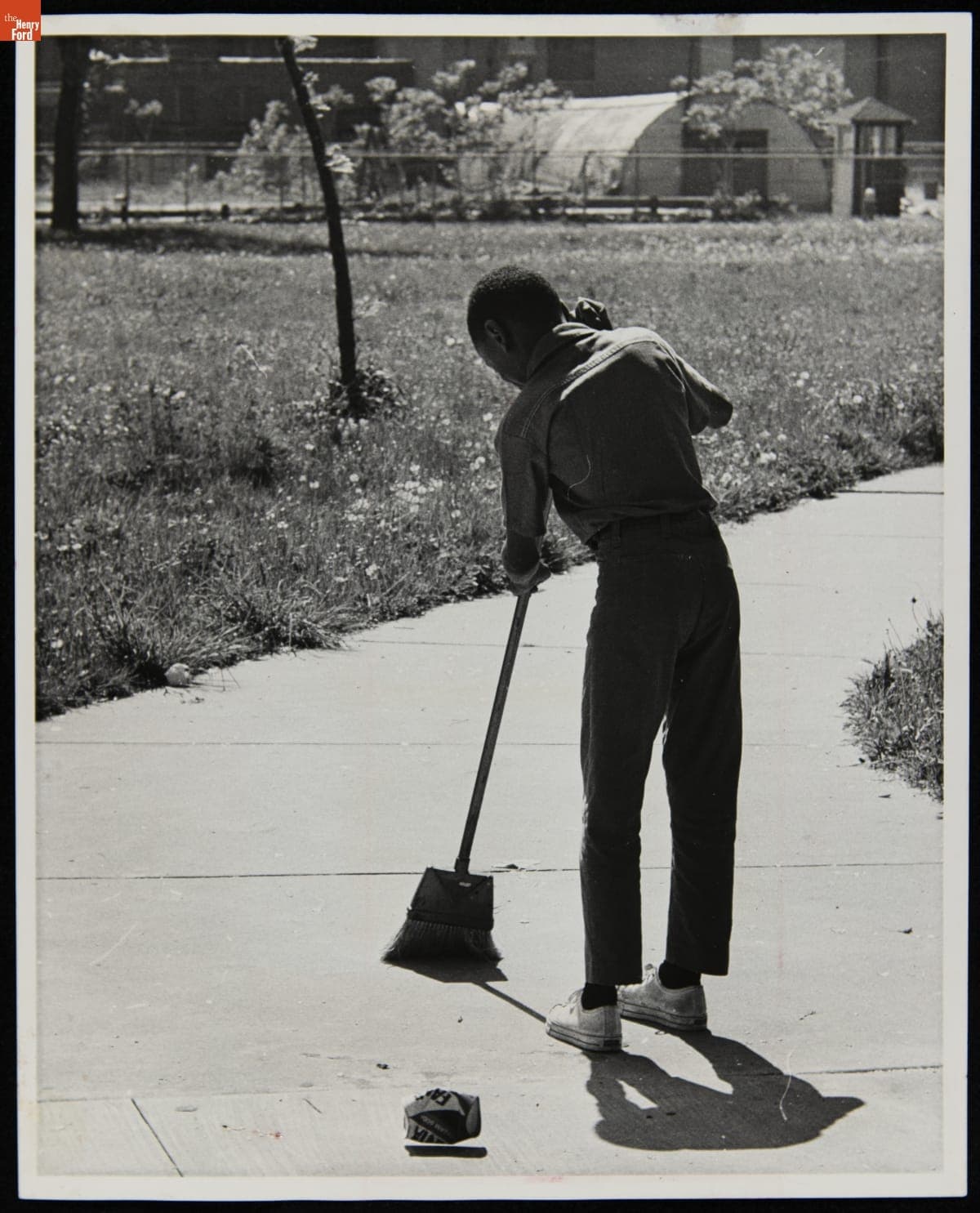Marcy Elementary School Fifth Grader Sweeps the Sidewalk at Bradley Playground in Detroit, May 1970