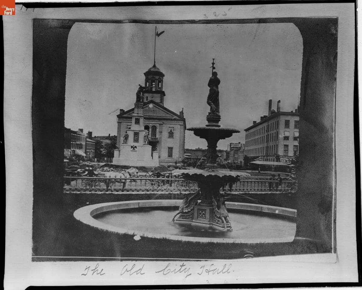 A Fountain and the Michigan Soldiers' and Sailors' Monument in front of Detroit's Original City Hall, 1872