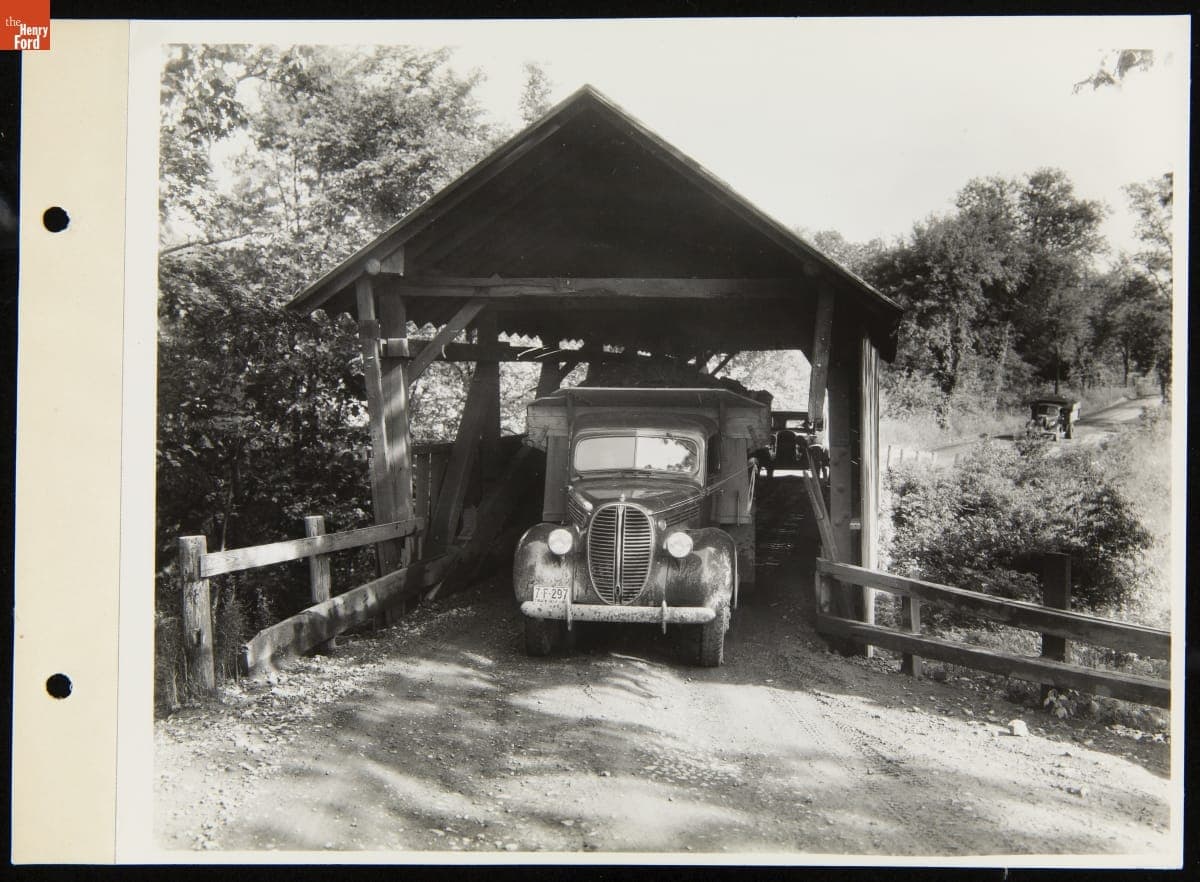 Ford V-8 Dump Truck Driving through a Covered Bridge, August 2, 1938