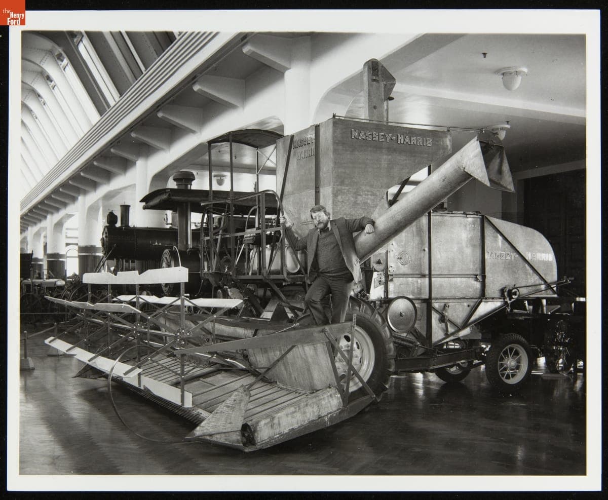 Peter Cousins with the Massey-Harris Model 20 Self-Propelled Combine in Henry Ford Museum, 1977
