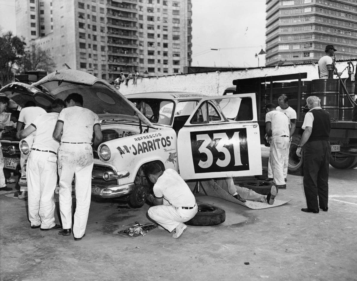 Mechanics Working on Race Car during the La Carrera Panamericana (Mexican Road Race), 1954