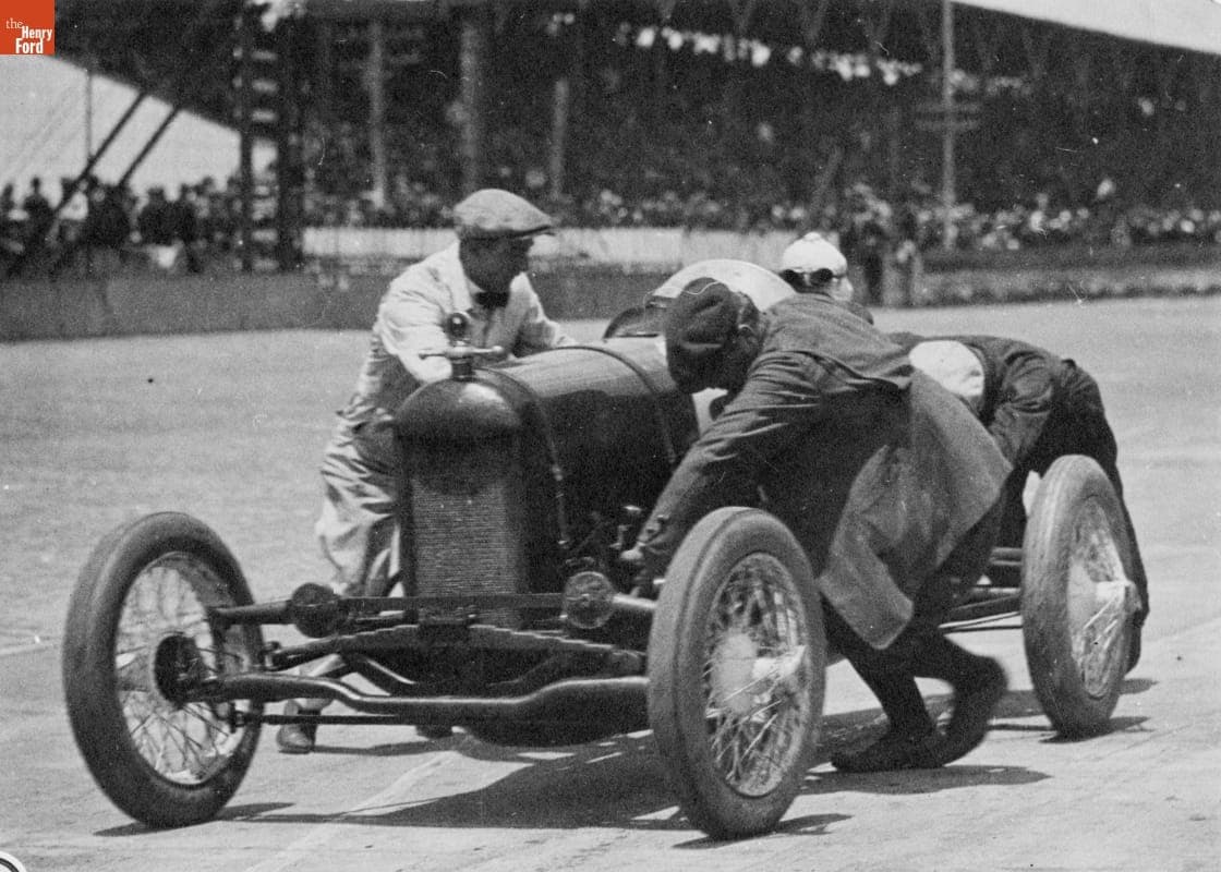 Three Men Pushing a Barber-Warnock Special Race Car off the Track at Indianapolis Motor Speedway, probably 1924