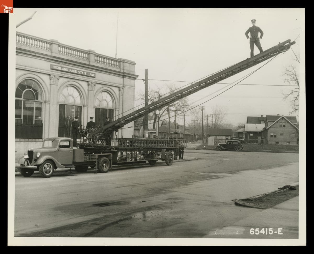 Ford V-8 Fire Truck Tractor with Hook and Ladder Trailer at the Highland Park State Bank, March 12, 1936
