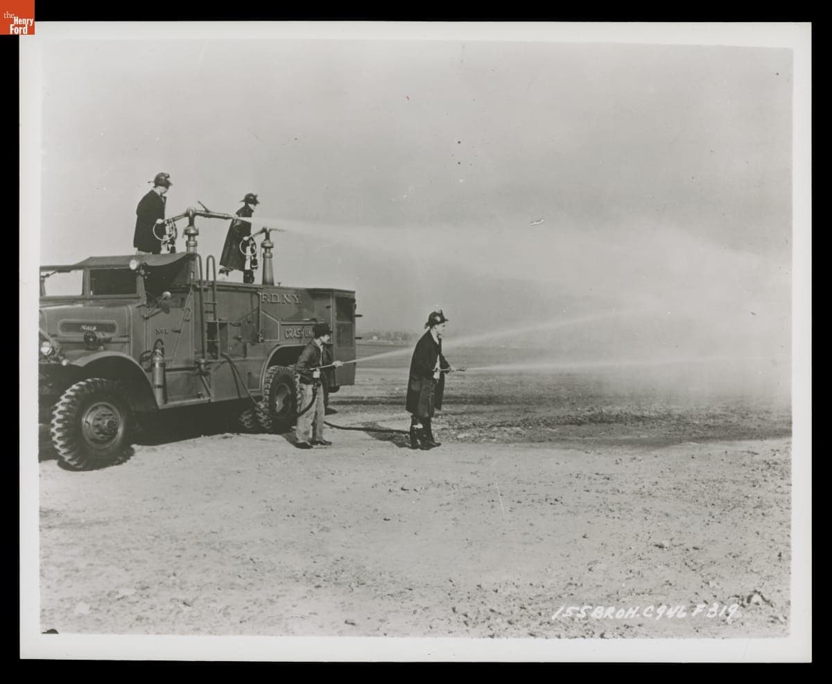 New York Fire Department Crash Unit Firemen Using the Hoses on a Fire Truck, 1945-1950