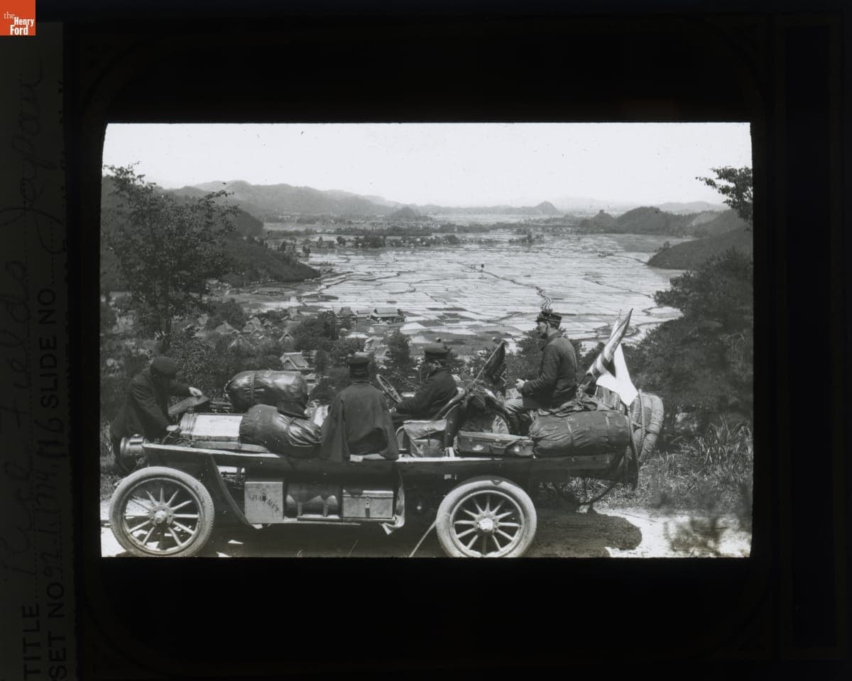 Team Sitting in the Thomas Flyer Looking over Rice Paddies in Japan, New York to Paris Race, 1908