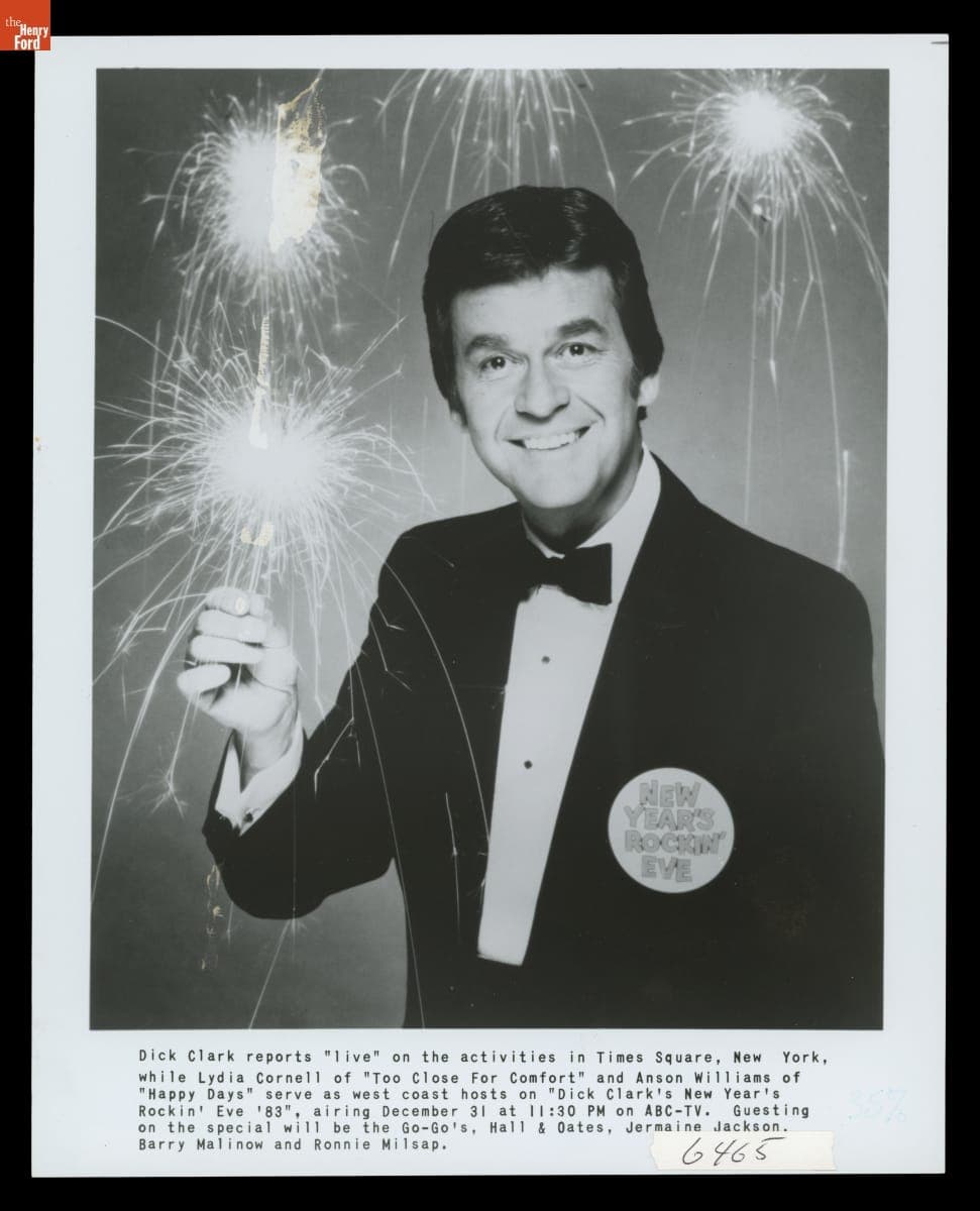 Dick Clark, Host of "New Year's Rockin' Eve," Holding a Sparkler, 1983