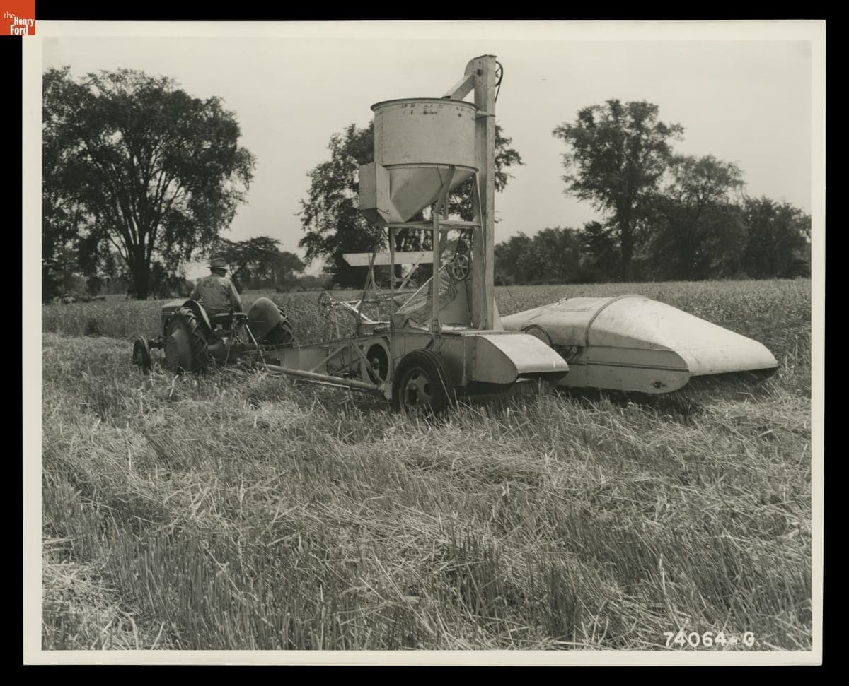 Man Driving a Ford-Ferguson Tractor with Ferguson Combine Attached, August 1940