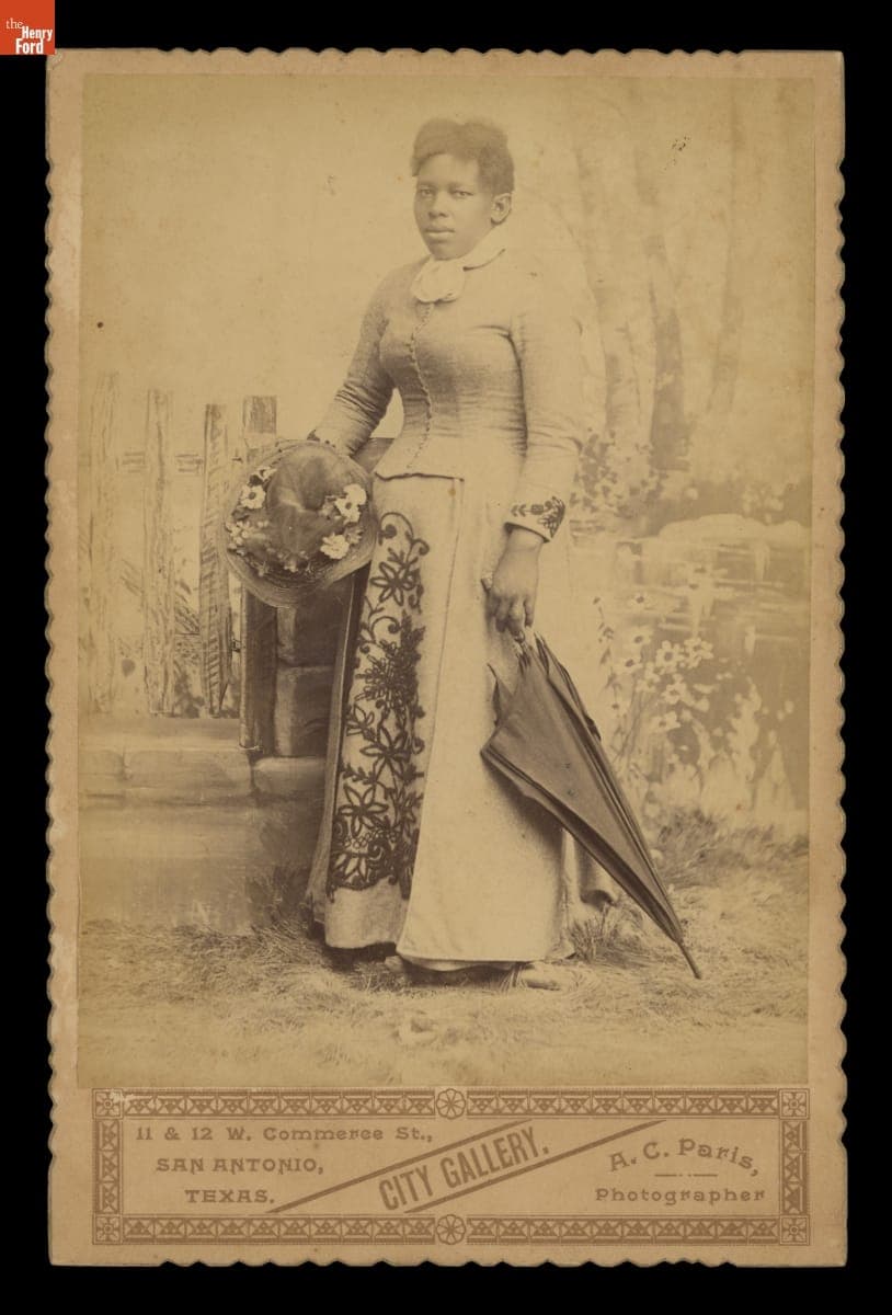 Woman Holding Flower-Trimmed Hat and Umbrella, 1887-1894