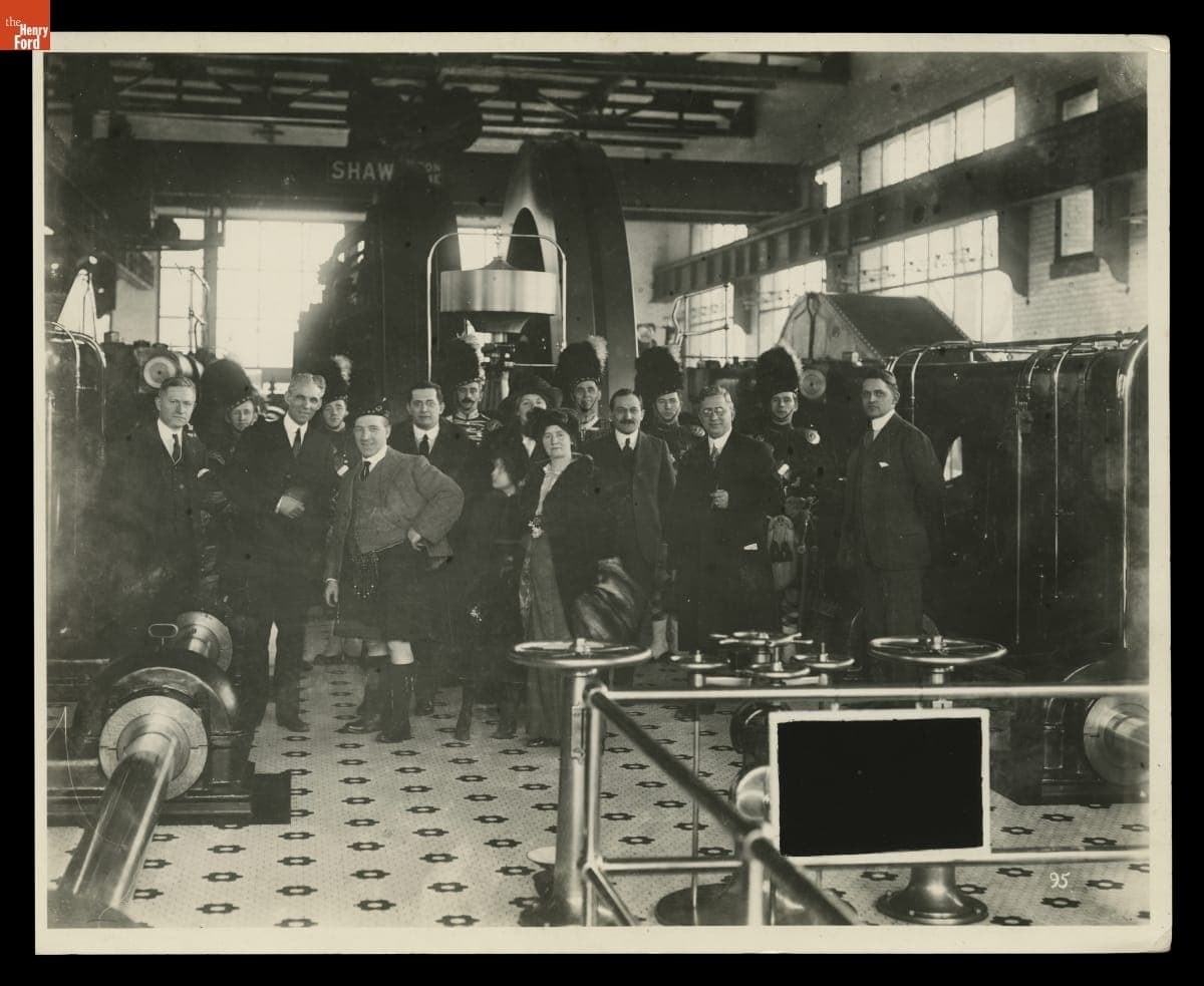 Henry Ford, Charles Sorensen, and Sir Harry Lauder with Bagpipers in the Highland Park Plant Powerhouse, 1914