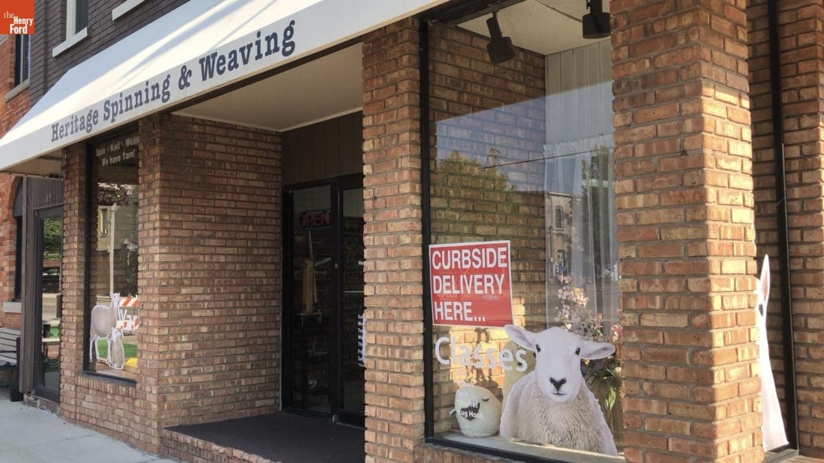 Heritage Spinning & Weaving Shop with Curbside Delivery Sign in Window. 2020