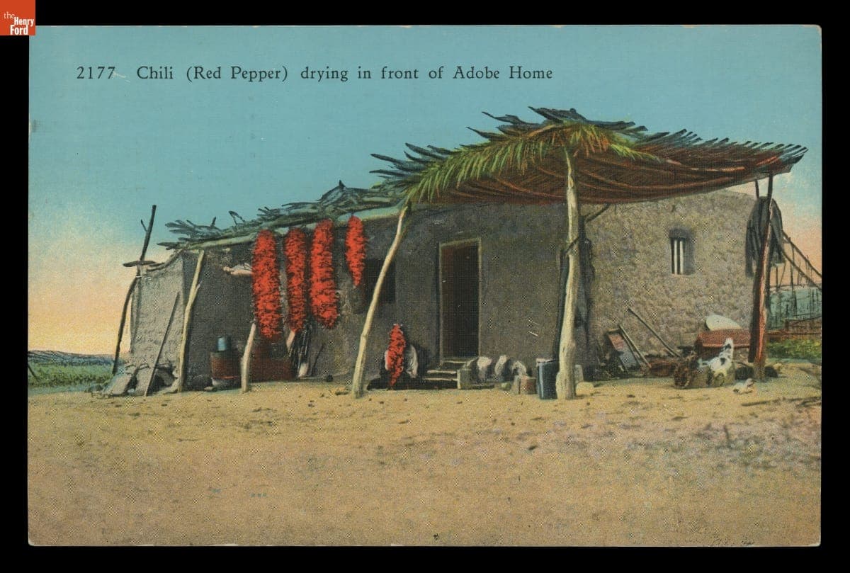 "Chili (Red Pepper) Drying in Front of Adobe Home," circa 1937