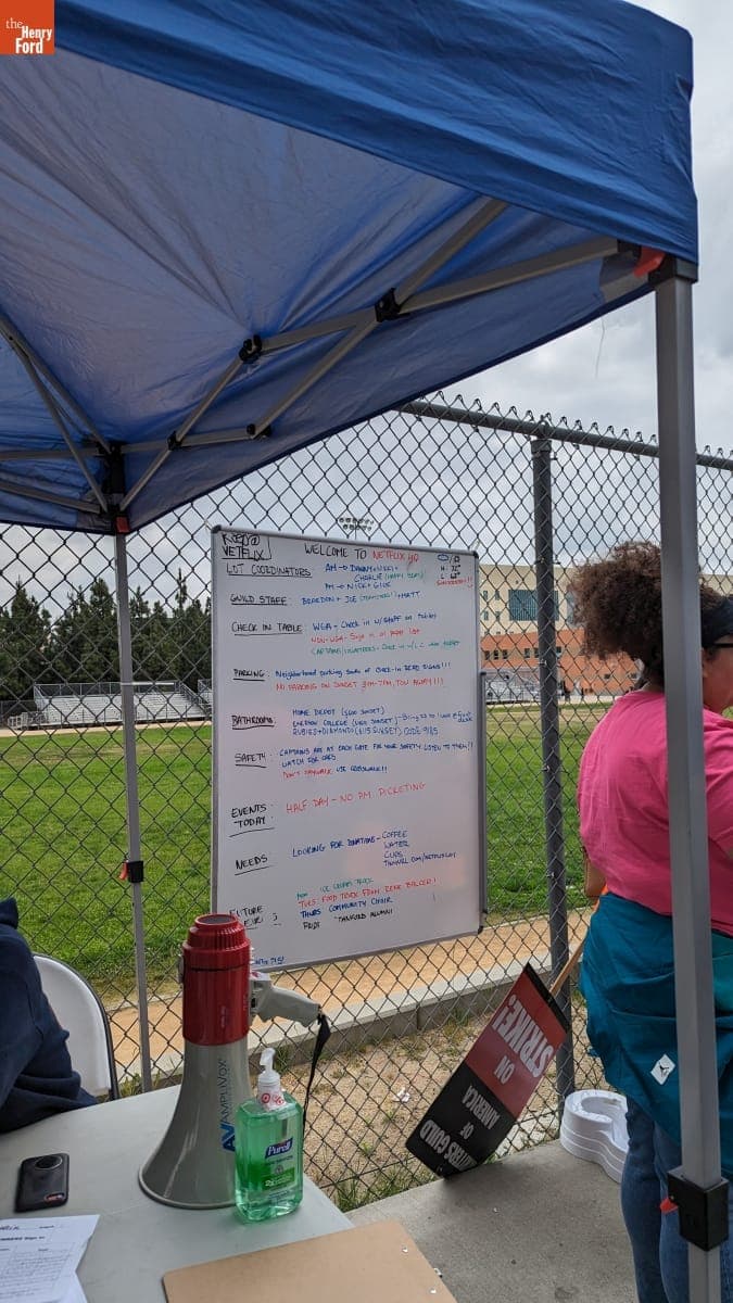 Writers Guild of America Picket Line Check-in Tent with Daily Schedule, Safety, and Other Notes, June 3, 2023