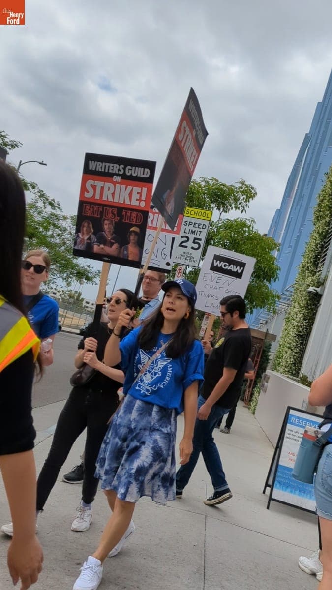 Writers Guild of America Strike Picketer Holding Sign that Reads "Eat Us, Ted," June 3, 2023