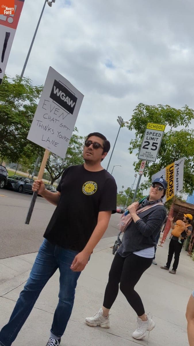 Writers Guild of America West Picketer Holding Sign that Reads "Even ChatGPT Thinks You're Lame," June 3, 2023
