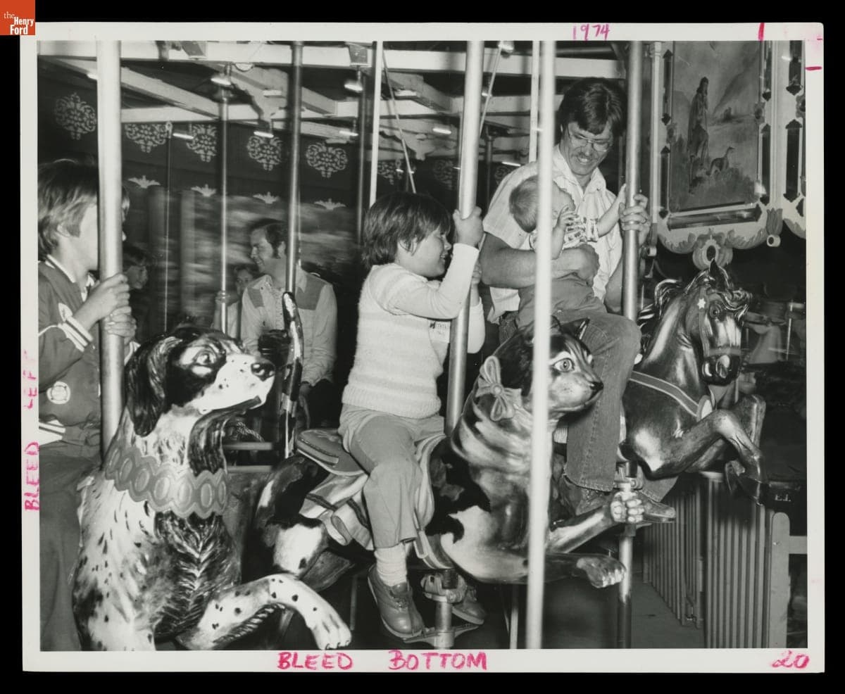 Visitors Riding the Herschell-Spillman Carousel in Greenfield Village, June 1977