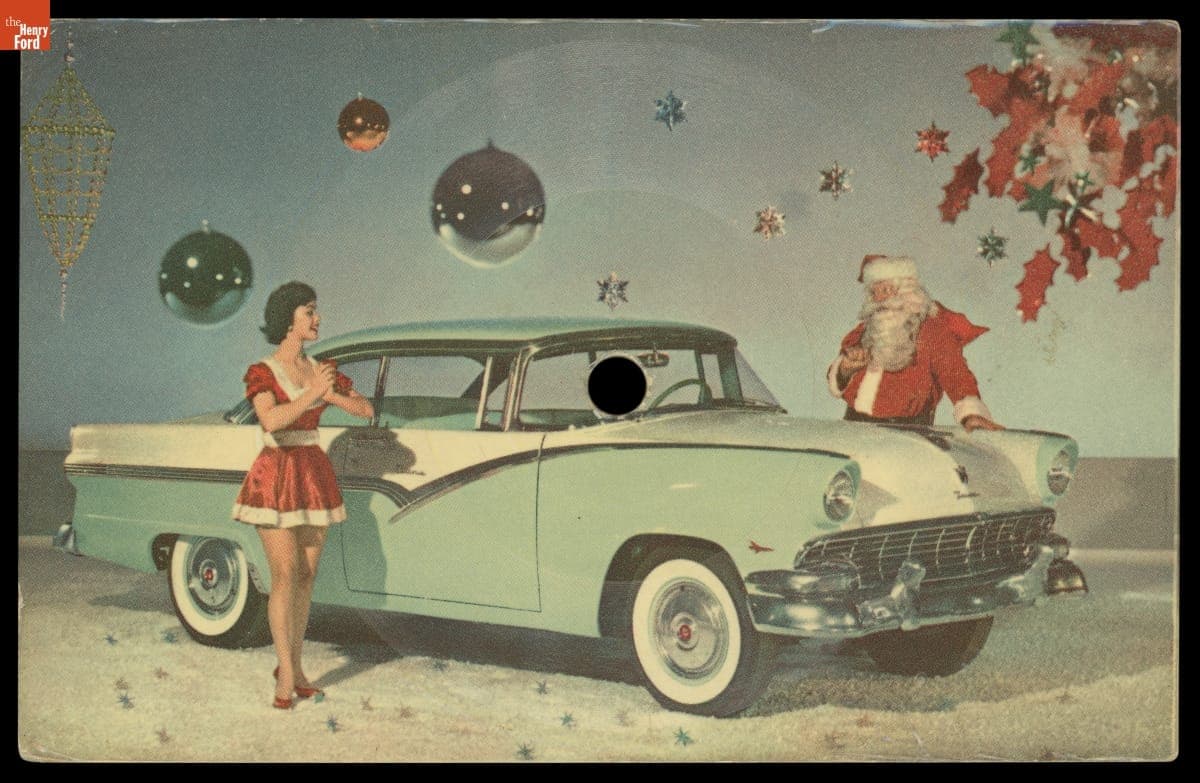 Santa and his Helper with a 1956 Ford Fairlane Victoria