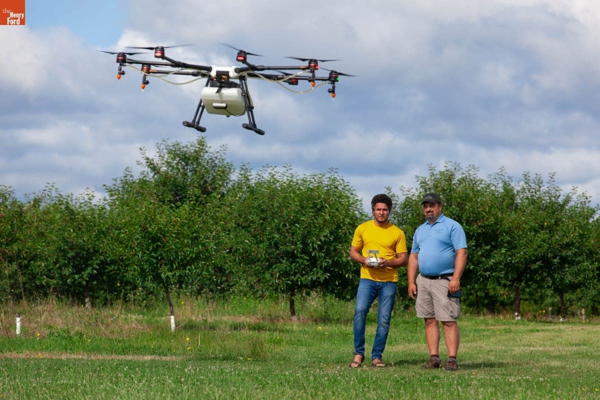 Two Men Working with the "Agras MG-1" Drone