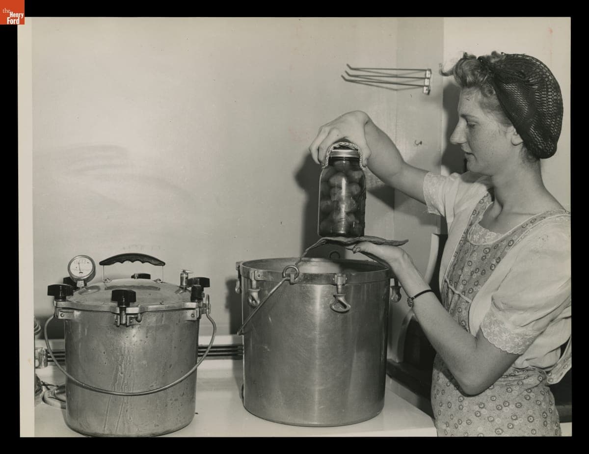 Macon (Michigan) High School Student Marjorie Korth Removes a Jar of Beets from Pressure Cooker, August 1943