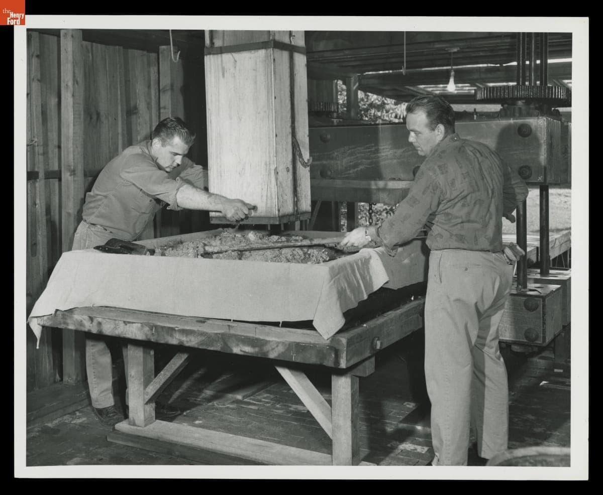 Dick Sikorski and Sherman Garrison Load Crushed Apples into the Cider Press at Greenfield Village Cider Mill, October 1967