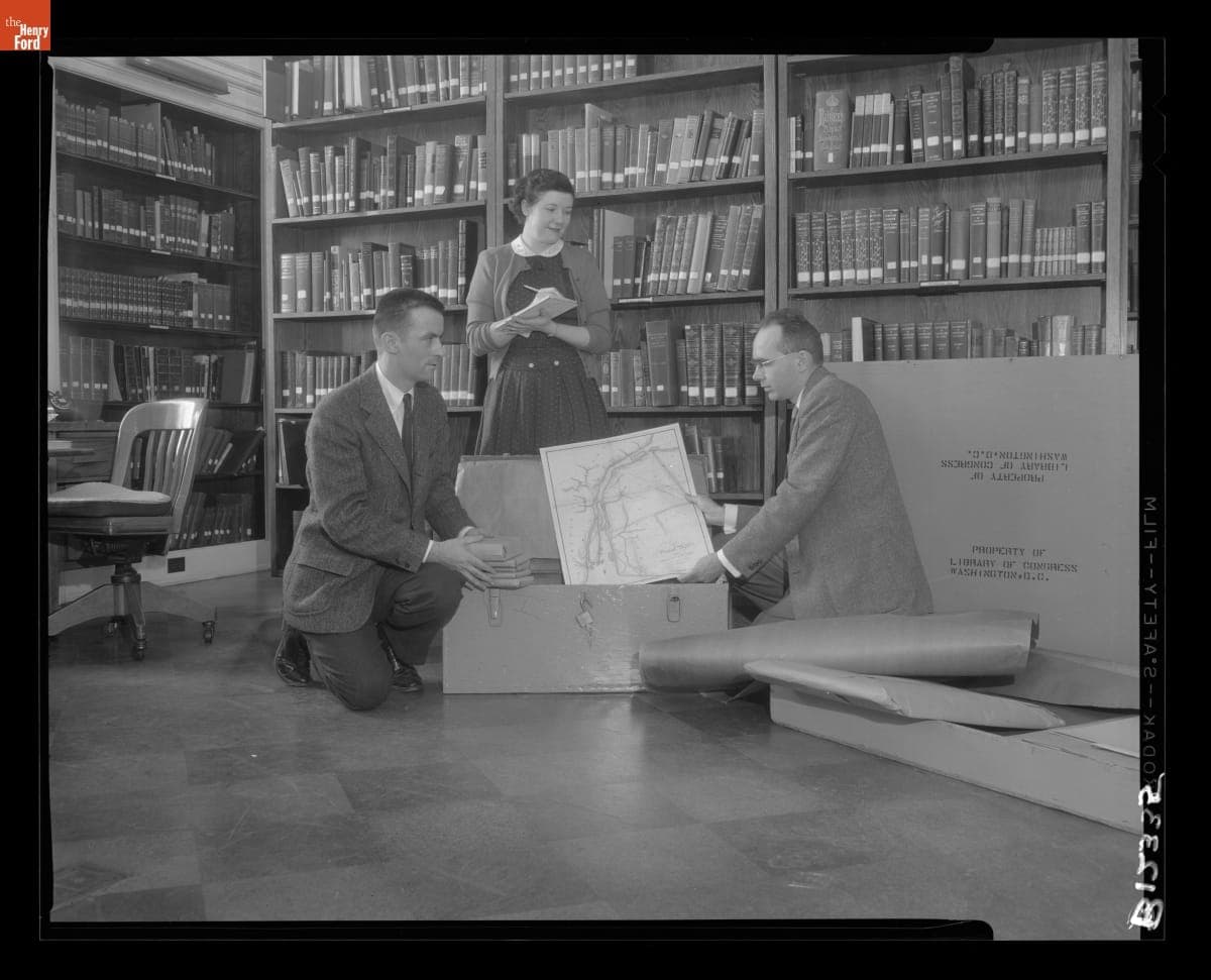 Gerald Gibson, Margaret Crump and Ken Metcalf View Maps in Edison Institute Library for Possible Exhibit Use, May 1, 1956