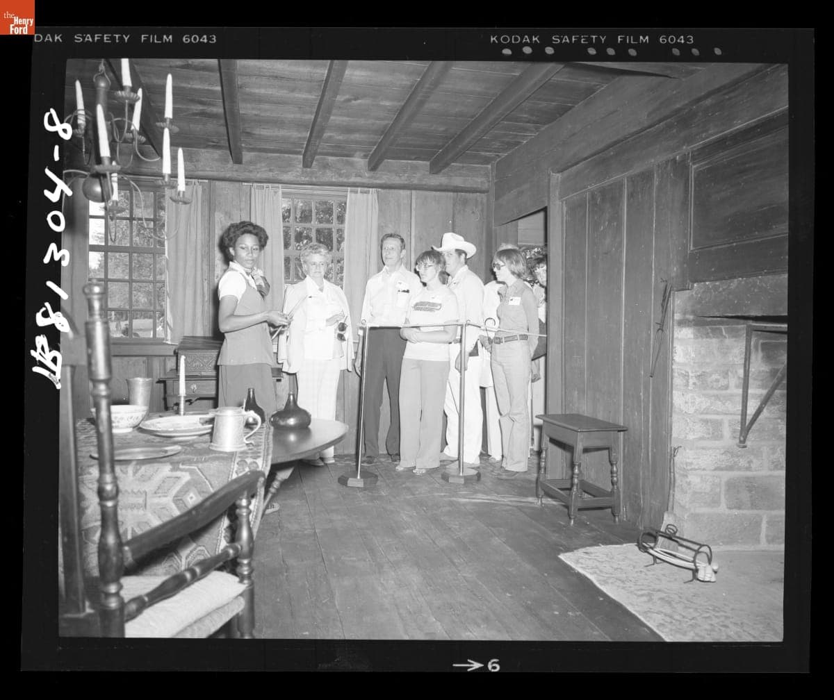 Guide Kim Turner Shows Visitors the Interior of Daggett Farmhouse in Greenfield Village, June 1978